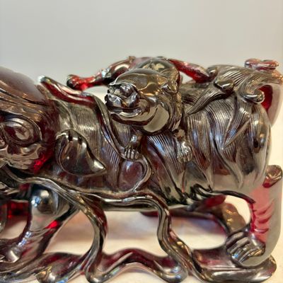 A pair of Chinese carved cherry amber 'Buddhist lions' groups — photo 15