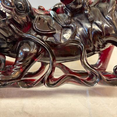 A pair of Chinese carved cherry amber 'Buddhist lions' groups — photo 17