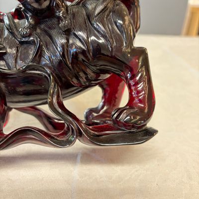 A pair of Chinese carved cherry amber 'Buddhist lions' groups — photo 18