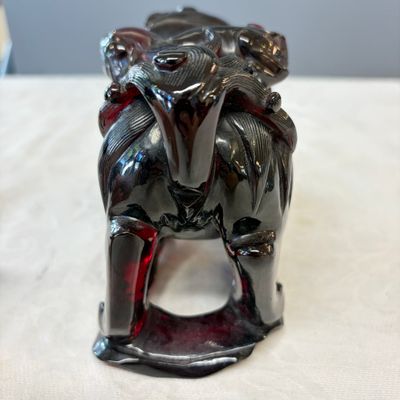 A pair of Chinese carved cherry amber 'Buddhist lions' groups — photo 19