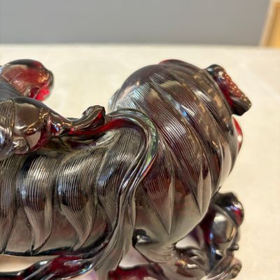 A pair of Chinese carved cherry amber 'Buddhist lions' groups — photo 21