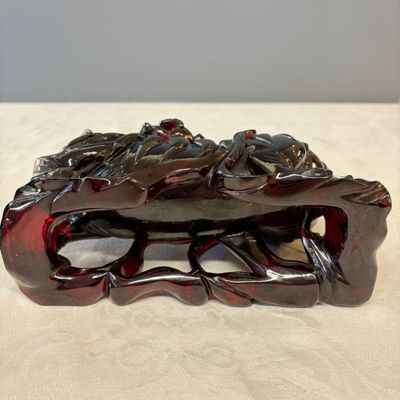 A pair of Chinese carved cherry amber 'Buddhist lions' groups — photo 25