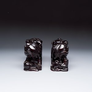 A pair of Chinese carved cherry amber 'Buddhist lions' groups — photo 3