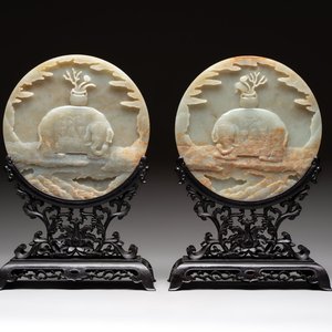 A pair of Chinese carved jade ‘elephant’ plaques on wooden stands, 19th C. — photo 1