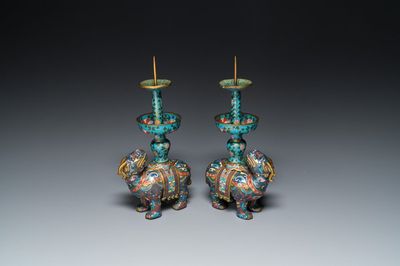 A pair of Chinese cloisonné candlesticks in the shape of pixiu, Qing