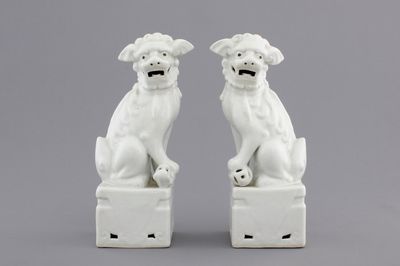 A pair of Chinese Dehua blanc de Chine figures of foo dogs or guardian lions, 19/20th