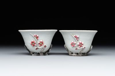 A pair of Chinese Dehua blanc de Chine relief-decorated famille rose 'prunus' cups, 19th C.