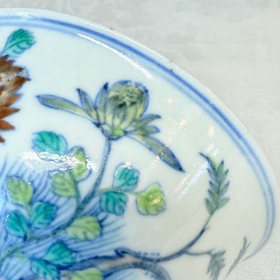 A pair of Chinese doucai bowls with floral design — photo 21