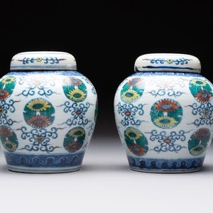 A pair of Chinese doucai 'chrysanthemum' jars and covers, Daoguang mark and of the period — photo 1