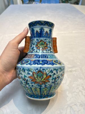 A pair of Chinese doucai 'Hu' vases with lotus scroll design, Qianlong mark, 19th C. — photo 1