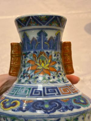 A pair of Chinese doucai 'Hu' vases with lotus scroll design, Qianlong mark, 19th C. — photo 16