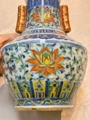A pair of Chinese doucai 'Hu' vases with lotus scroll design, Qianlong mark, 19th C. — photo 17