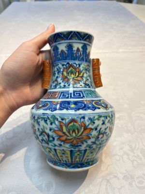 A pair of Chinese doucai 'Hu' vases with lotus scroll design, Qianlong mark, 19th C. — photo 3