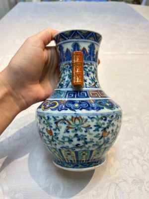 A pair of Chinese doucai 'Hu' vases with lotus scroll design, Qianlong mark, 19th C. — photo 4