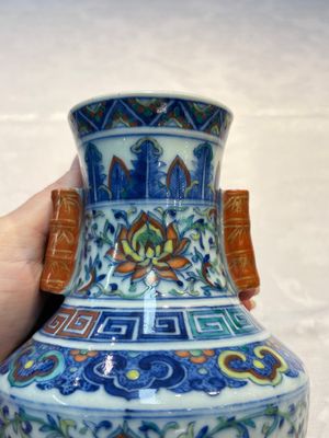 A pair of Chinese doucai 'Hu' vases with lotus scroll design, Qianlong mark, 19th C. — photo 7