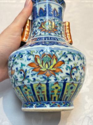 A pair of Chinese doucai 'Hu' vases with lotus scroll design, Qianlong mark, 19th C. — photo 8