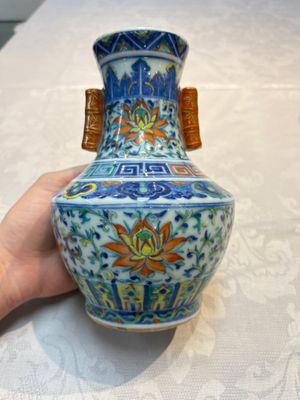 A pair of Chinese doucai 'Hu' vases with lotus scroll design, Qianlong mark, 19th C. — photo 9