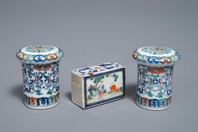 A pair of Chinese doucai scroll ends and a famille rose paper weight, 19/20th C.