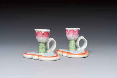 A pair of Chinese export famille rose lotus-form chambersticks on ruyi-shaped bases, Qianlong