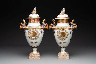 A pair of Chinese export famille rose urns and covers, Qianlong