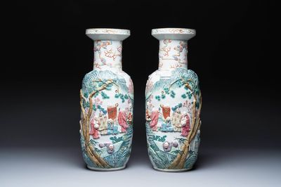 A pair of Chinese famille rose '18 Luohan' vases with relief design, 19th C.
