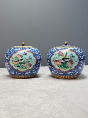 A pair of Chinese famille rose 'Birds among Flowering Branches' jars and covers — photo 1
