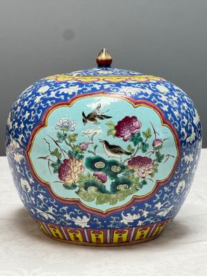 A pair of Chinese famille rose 'Birds among Flowering Branches' jars and covers — photo 17