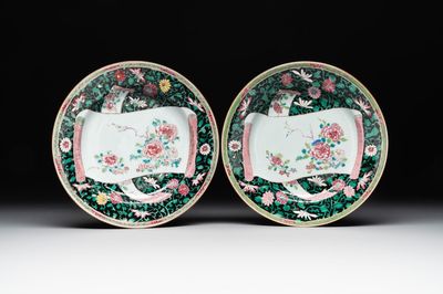 A pair of Chinese famille rose black-ground 'flowers and scrolls' plates, Yongzheng/Qianlong