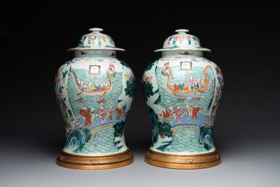 A pair of Chinese famille rose 'hundred boys' vases and covers on wooden stands, 19th C.