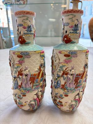 A pair of Chinese famille rose 'Immortals' vases with relief design, Qianlong mark, Republic — photo 1