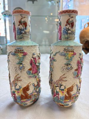 A pair of Chinese famille rose 'Immortals' vases with relief design, Qianlong mark, Republic — photo 3
