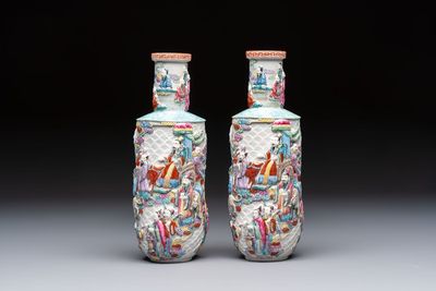 A pair of Chinese famille rose 'Immortals' vases with relief design, Qianlong mark, Republic