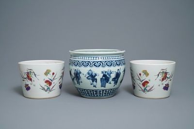 A pair of Chinese famille rose jardinières and a blue and white example, 19th C.