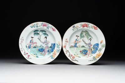 A pair of Chinese famille rose 'ladies in a garden' plates, Yongzheng