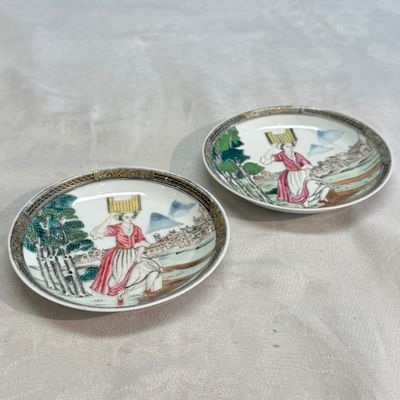 A pair of Chinese famille rose 'Milkmaid' saucers — photo 1