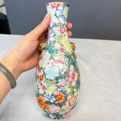 A pair of Chinese famille rose 'Millefleurs' vases with lion-head handles — photo 4