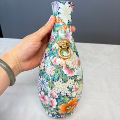 A pair of Chinese famille rose 'Millefleurs' vases with lion-head handles — photo 16