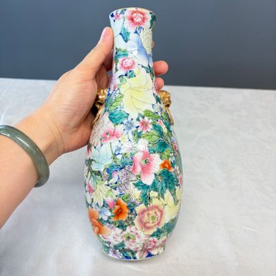 A pair of Chinese famille rose 'Millefleurs' vases with lion-head handles — photo 17