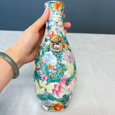 A pair of Chinese famille rose 'Millefleurs' vases with lion-head handles — photo 18