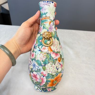 A pair of Chinese famille rose 'Millefleurs' vases with lion-head handles — photo 3