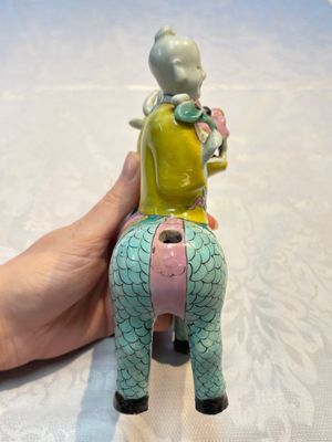 A pair of Chinese famille rose models of a boy riding a qilin and a bitong, 19/20th C. — photo 26