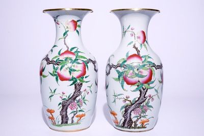 A pair of Chinese famille rose "nine peaches" vases, 19th C.
