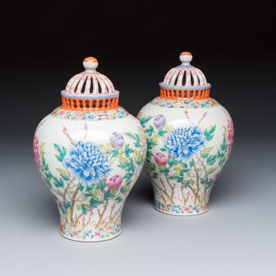 A pair of Chinese famille rose openworked vases and covers with peonies, Republic