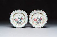 A pair of Chinese famille rose 'Peacock and Flowers' plates, Yongzheng