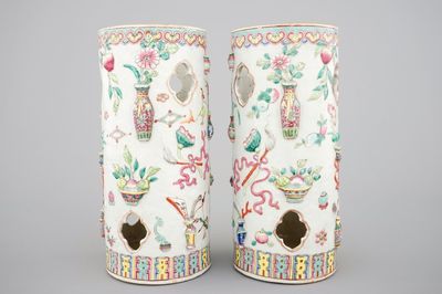 A pair of Chinese famille rose porcelain relief-moulded hat stands, 19th C.