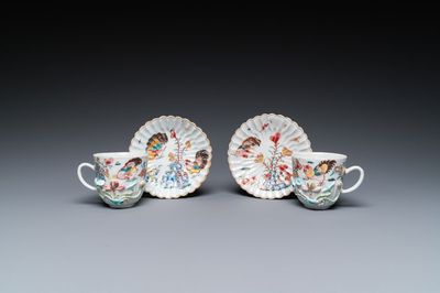 A pair of Chinese famille rose relief-decorated cups and saucers, Yongzheng