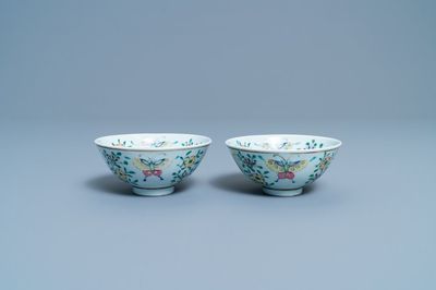 A pair of Chinese famille rose rice grain pattern 'butterfly' bowls, Qianlong mark, 18/19th C.