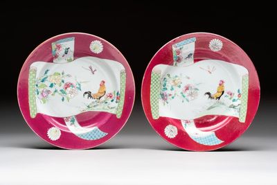 A pair of Chinese famille rose ruby-ground 'scrolls and rooster' plates, Yongzheng