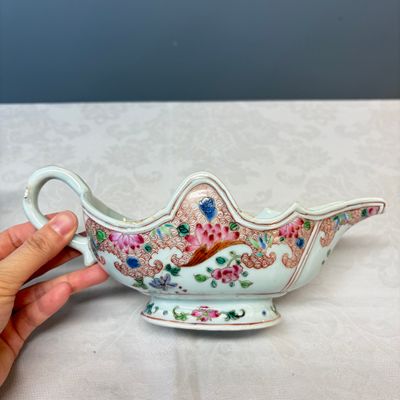 A pair of Chinese famille rose sauceboats with floral scroll design — photo 11