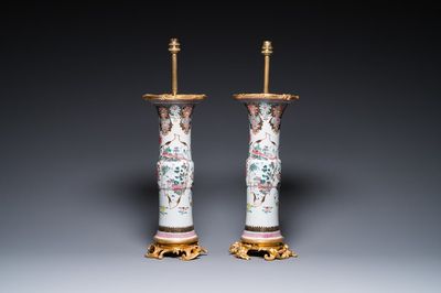 A pair of Chinese famille rose vases with fine gilt bronze lamp mounts, Yongzheng